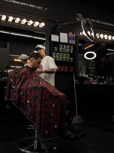 A barber at work at Escape Barbershop