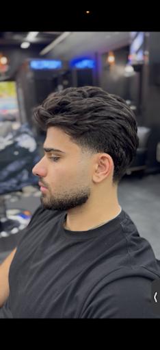 Textured quiff with a mid fade